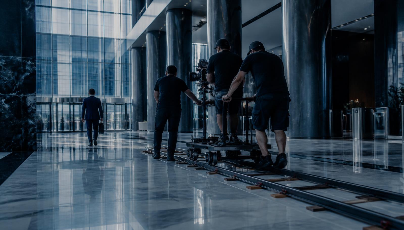 Camera dolly and track laid across a corporate lobby — BFSI video production in Mumbai