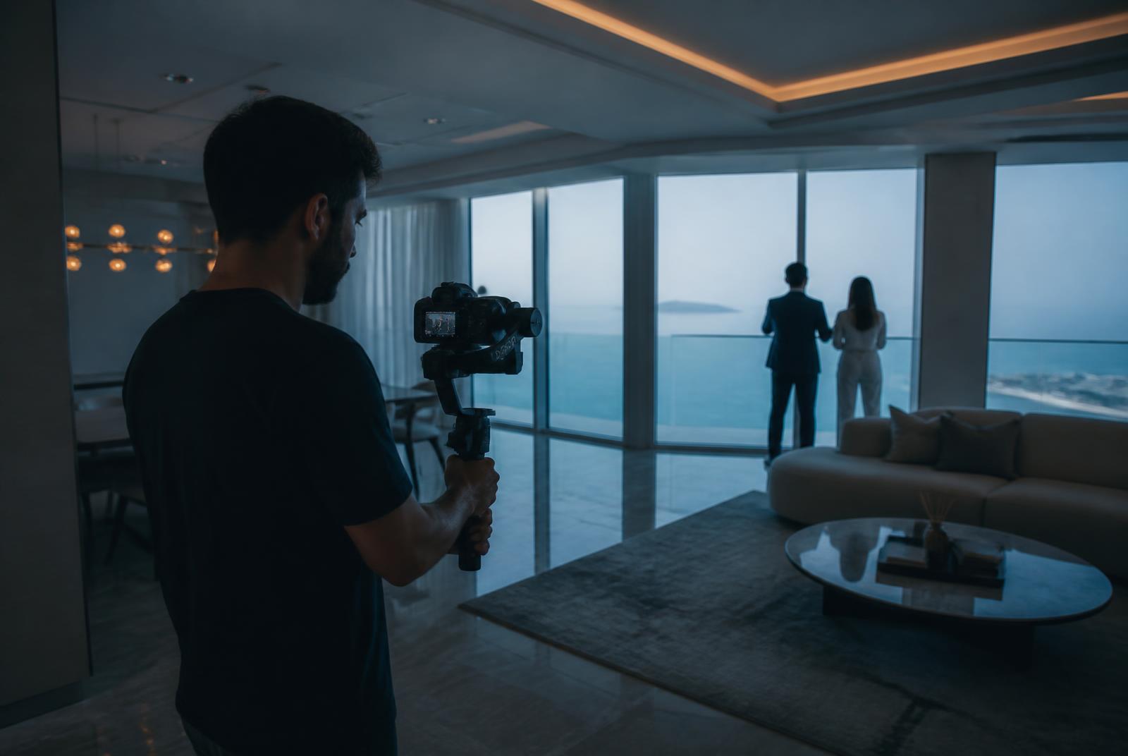 Gimbal operator filming a walkthrough of a sea-facing show apartment — Architectural Walkthrough Video in Chembur, Mumbai