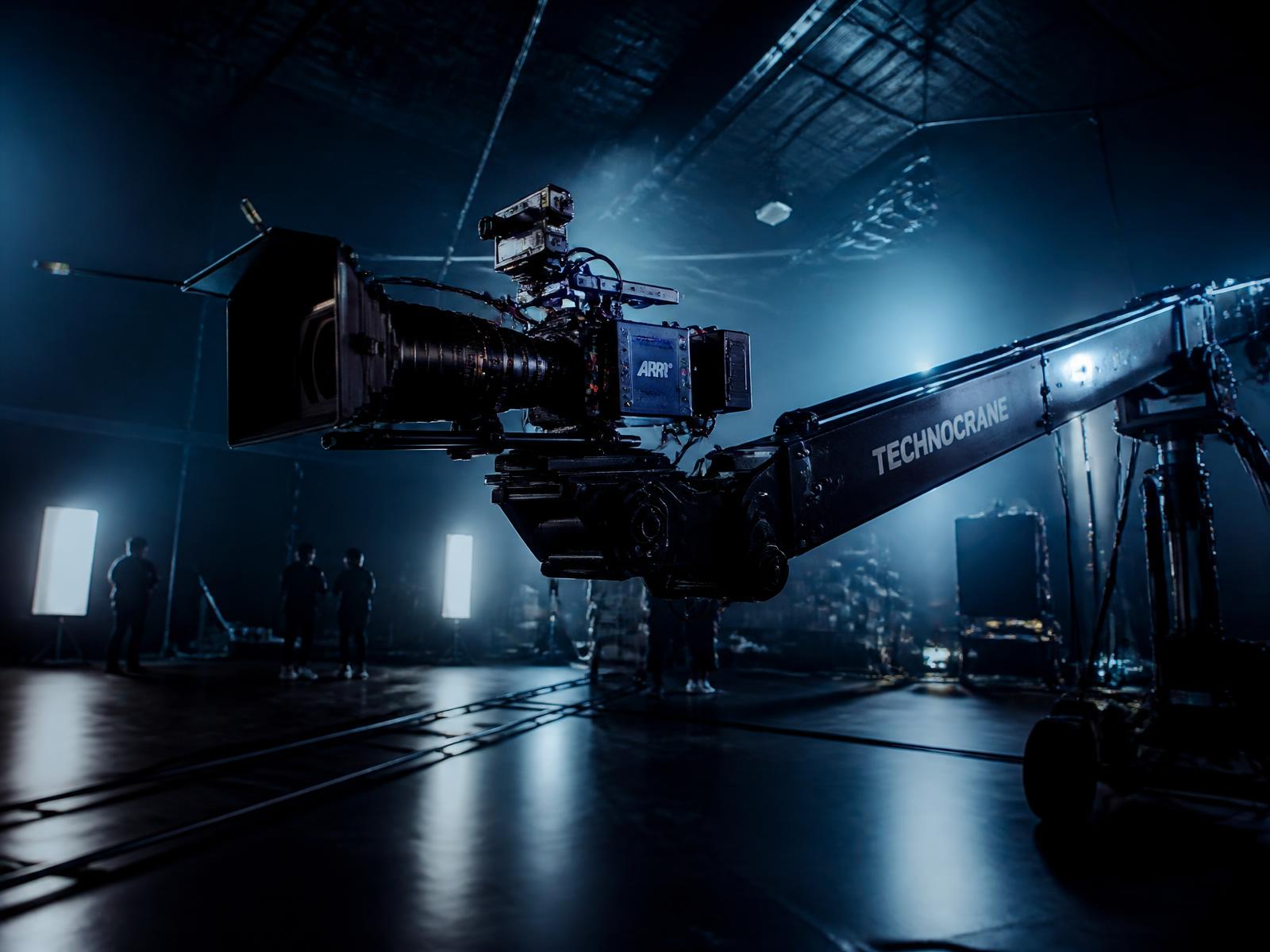 Cinema camera mounted on a technocrane jib arm on a film set