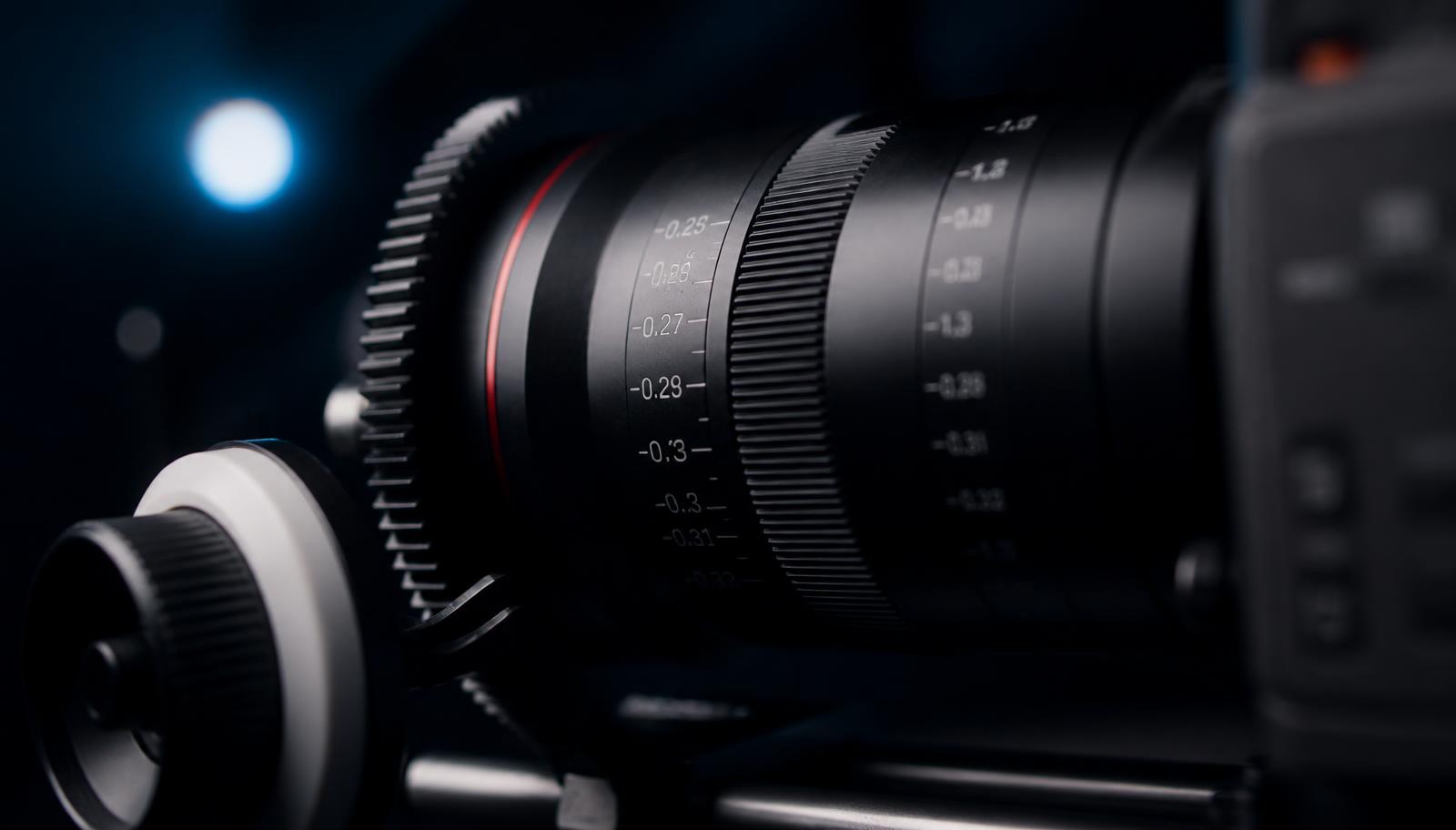 Close-up of a cinema camera lens with follow focus